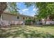 A backyard featuring mature trees, a porch swing, and a garden at 4100 Sudbury Rd, Charlotte, NC 28205