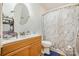 A full bathroom featuring a marble shower curtain and wood vanity at 4100 Sudbury Rd, Charlotte, NC 28205