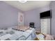 A bedroom featuring hardwood floors, a window and light purple walls at 4100 Sudbury Rd, Charlotte, NC 28205