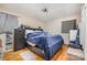 Simple bedroom featuring natural light, hardwood floors, and neutral colored walls at 4100 Sudbury Rd, Charlotte, NC 28205