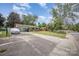 Cozy home with a long driveway and a well-maintained front yard at 4100 Sudbury Rd, Charlotte, NC 28205