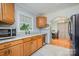 Charming kitchen with wooden cabinetry and stainless steel appliances at 4100 Sudbury Rd, Charlotte, NC 28205