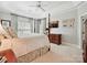 Bedroom featuring a four-poster bed, trey ceilings, and light gray walls at 4608 Morrowick Rd, Charlotte, NC 28226