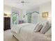 Bright bedroom featuring white walls, crown molding, and windows with patterned valances at 4608 Morrowick Rd, Charlotte, NC 28226