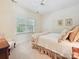 Comfortable bedroom with a charming bedspread, bright natural light, and a cozy reading corner at 4608 Morrowick Rd, Charlotte, NC 28226