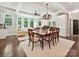 Open concept dining room and living room with lots of windows at 4608 Morrowick Rd, Charlotte, NC 28226
