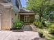 Exterior rear facade of home features stone walkway and garden, providing privacy and curb appeal at 4608 Morrowick Rd, Charlotte, NC 28226