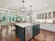Bright kitchen with island, dishwasher and open dining area with lots of windows at 4608 Morrowick Rd, Charlotte, NC 28226