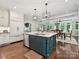 Kitchen with eat in island, modern appliances, and hardwood floors at 4608 Morrowick Rd, Charlotte, NC 28226