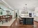 Bright, open-concept kitchen with center island, granite countertops, and stainless steel appliances at 4608 Morrowick Rd, Charlotte, NC 28226