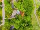 Aerial view showcases a house with a private pool, deck area, and mature trees in a lush neighborhood at 4609 Rounding Run Rd, Charlotte, NC 28277
