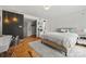 Bright bedroom features a unique accent wall, natural light, and an inviting, comfortable space at 4609 Rounding Run Rd, Charlotte, NC 28277