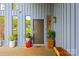 Stylish front door with modern design elements, complemented by potted plants and a welcoming porch at 4609 Rounding Run Rd, Charlotte, NC 28277