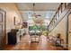 Inviting living room with skylights, hardwood floors, a vaulted ceiling, and stylish decor at 4609 Rounding Run Rd, Charlotte, NC 28277