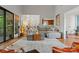 Spacious living room with hardwood floors, modern furniture, and access to the outdoors, perfect for entertaining at 4609 Rounding Run Rd, Charlotte, NC 28277
