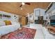 Comfortable living room with a wood-paneled ceiling, decorative rug, built-in shelving, and comfortable seating at 4609 Rounding Run Rd, Charlotte, NC 28277