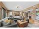 Comfortable living room with plush sofa, wooden coffee table, and large sliding doors at 4609 Rounding Run Rd, Charlotte, NC 28277
