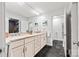 Stylish main bathroom with double sinks, generous countertop space, and walk-in closet at 4609 Rounding Run Rd, Charlotte, NC 28277