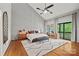 Bright main bedroom boasts vaulted ceiling with ceiling fan and sliding doors to the outdoors at 4609 Rounding Run Rd, Charlotte, NC 28277