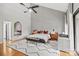 Stylish main bedroom with patterned accent wall, hardwood floors, and private outdoor access at 4609 Rounding Run Rd, Charlotte, NC 28277