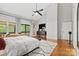 Bright main bedroom with ceiling fan, ensuite, and sliding doors to the outdoors at 4609 Rounding Run Rd, Charlotte, NC 28277