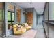 Cozy screened porch features stylish seating, wood art and hanging planters, creating a relaxing outdoor space at 4609 Rounding Run Rd, Charlotte, NC 28277