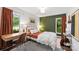 Bright bedroom featuring a work space area, a green accent wall, neutral decor and natural light at 50 Honeysuckle Woods, Lake Wylie, SC 29710