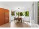 Bright dining area with large windows overlooking the trees at 50 Honeysuckle Woods, Lake Wylie, SC 29710