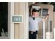 Smiling security guard waves from the building entrance at 50 Honeysuckle Woods, Lake Wylie, SC 29710