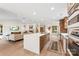 Open kitchen and living room, with large island and modern appliances at 50 Honeysuckle Woods, Lake Wylie, SC 29710