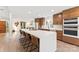 Bright and modern kitchen featuring a large island with seating and sleek cabinetry at 50 Honeysuckle Woods, Lake Wylie, SC 29710