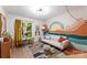 Bright and whimsical living room featuring a mural and slider to an outdoor area at 50 Honeysuckle Woods, Lake Wylie, SC 29710