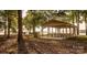 Picturesque lakeside pavilion with picnic tables, perfect for community gatherings and outdoor dining at 50 Honeysuckle Woods, Lake Wylie, SC 29710