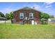 Brick house backyard with a spacious lawn, fenced perimeter, and potential for outdoor enjoyment and activities at 502 Kings Mountain St, Clover, SC 29710