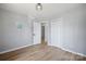Bright bedroom features wood floors, modern lighting, and a spacious closet at 502 Kings Mountain St, Clover, SC 29710