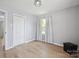 Cozy bedroom with hardwood floors, a closet and natural light at 502 Kings Mountain St, Clover, SC 29710