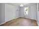 This bedroom has wood-look flooring, a double closet, and a light gray paint color at 502 Kings Mountain St, Clover, SC 29710
