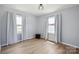 Bright bedroom with hardwood floors, ample natural light from the two windows at 502 Kings Mountain St, Clover, SC 29710