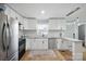 Bright kitchen featuring stainless steel appliances, white cabinets, and granite countertops at 502 Kings Mountain St, Clover, SC 29710