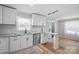 Bright kitchen with granite countertops, stainless steel appliances, and stylish pendant lighting at 502 Kings Mountain St, Clover, SC 29710