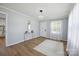 Inviting living room with wood floors, modern lighting, and neutral decor at 502 Kings Mountain St, Clover, SC 29710
