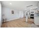 Open concept living room with hardwood floors seamlessly flowing into the modern kitchen at 502 Kings Mountain St, Clover, SC 29710