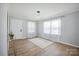 Well-lit living room with a bright rug, hardwood floors, and modern lighting at 502 Kings Mountain St, Clover, SC 29710