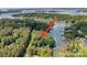 Beautiful aerial view of wooded lot on Lake Wylie with arrow pointing towards property at 505 Kemp Rd, Mooresville, NC 28117