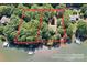 Aerial view of lakefront property showing approximate lot lines and boat dock at 505 Kemp Rd, Mooresville, NC 28117