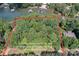 Overhead view of wooded property with potential boundaries, perfect for building your dream home near the water at 505 Kemp Rd, Mooresville, NC 28117