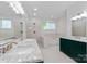 Bright bathroom boasting double vanity, marble countertops, and a soaking tub at 505 Kemp Rd, Mooresville, NC 28117