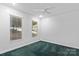 Bright bedroom with two large windows and carpet at 505 Kemp Rd, Mooresville, NC 28117