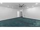 Spacious bedroom featuring modern ceiling fan, carpet, and neutral walls at 505 Kemp Rd, Mooresville, NC 28117