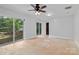 Spacious bedroom features a sliding glass door with views at 505 Kemp Rd, Mooresville, NC 28117